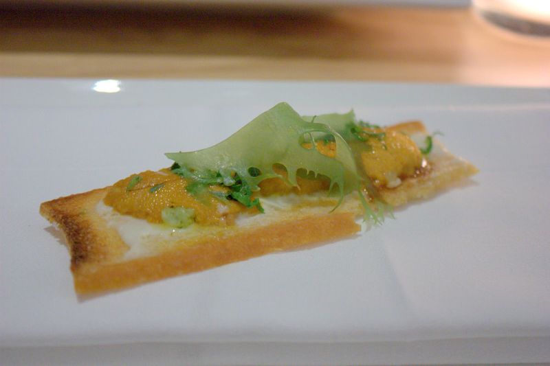 Aldea sea urchin toast, cauliflower cream, sea lettuce, lime